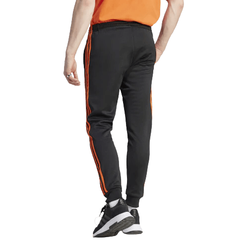 Adidas pants orange stripes sales