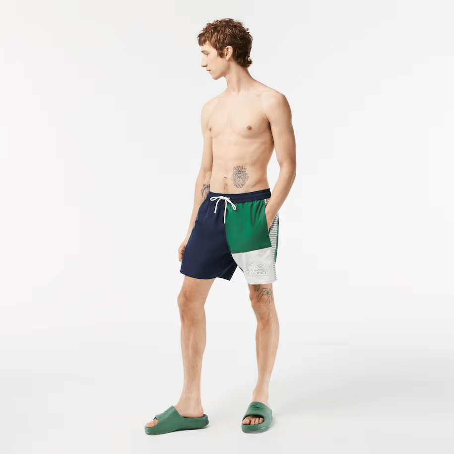https://gbny.com/cdn/shop/files/lacoste-apparel-men-s-recycled-polyester-colorblock-swim-trunks-29491780124768.png?v=1689616664&width=915